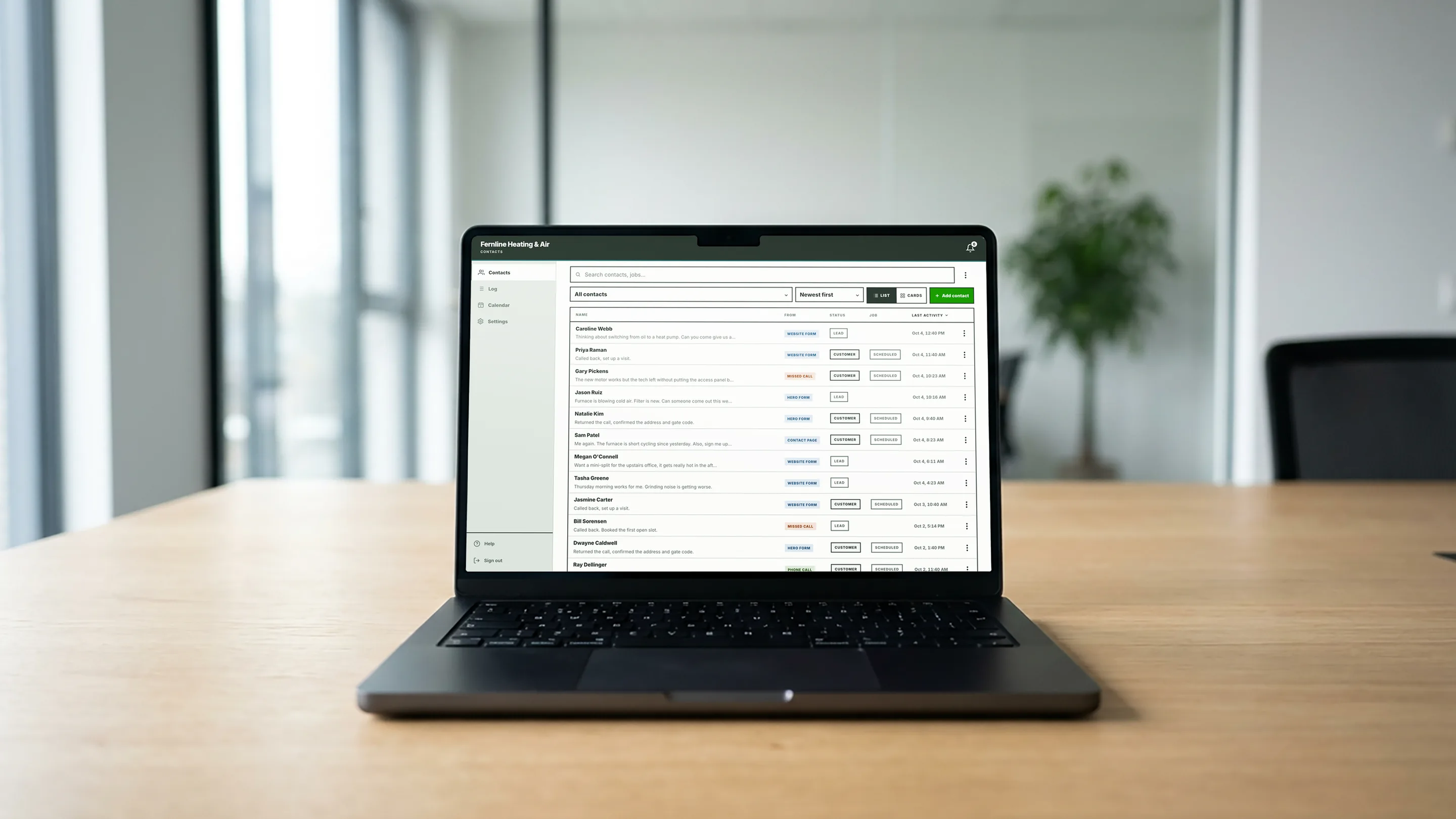 beachbird.app contacts list on a laptop on a conference table, showing new leads and customers for a heating and air company