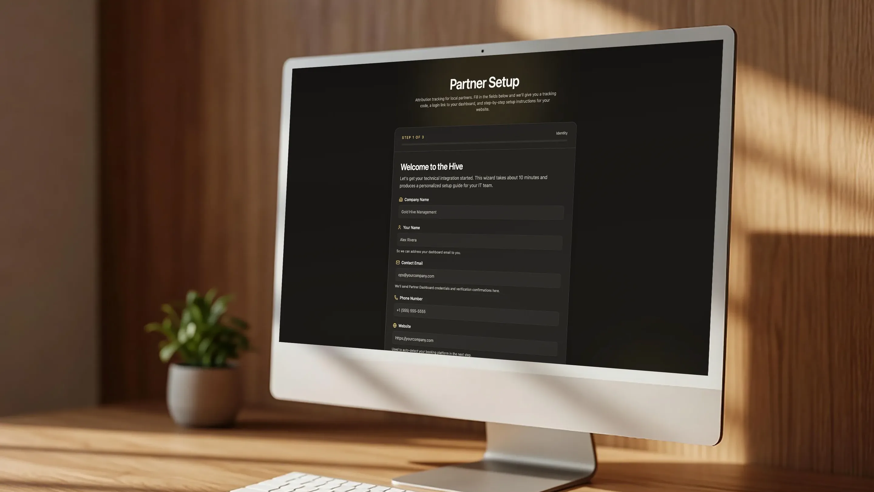 Gold Hive partner setup wizard on a desktop monitor, welcoming a new partner to the Hive